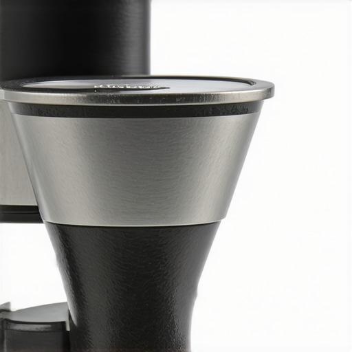 Close-up of conical burr grinder showing detailed burrs and precision engineering.